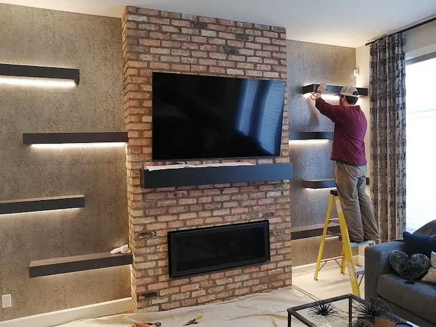 Good Guy Electric installing accent lighting on a feature wall